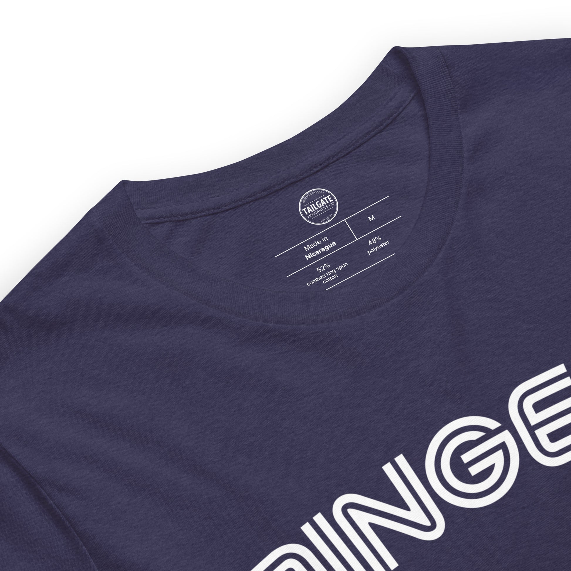 This image details the graphic design of the word "dingers" in a font similar to the Toronto Blue Jays. The font is in white and the tee is navy blue and is close up of the inside printed tag. This design is exclusive to tailgate mercantile and available only online.
