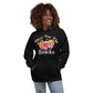 Image of woman wearing black hoodie with design of "Here For The Snacks" with cartoon hot dog, soda pop and popcorn located on centre chest. This design is exclusive to Tailgate Mercantile and available only online.