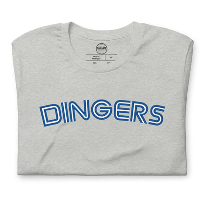 Close up image of heather athletic grey t-shirt with design of "DINGERS" in Toronto Blue Jays retro blue style font located on centre chest. This design is exclusive to Tailgate Mercantile and available only online.
