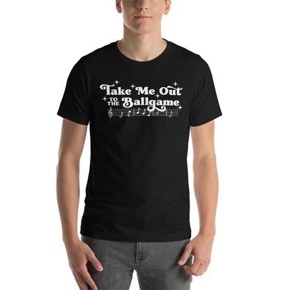 Image of man wearing black t-shirt with design of "Take Me Out to the Ballgame" with coordinating musical notes in white located on centre chest. This design is exclusive to Tailgate Mercantile and available only online.