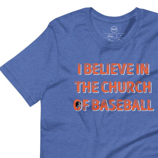 This image details the graphic design with the words "I believe in the church of baseball" with an image of a bull coming out of the O in "of". This shirt is an homage to the baseball movie Bull Durham featuring Kevin Costner and Susan Sarandon. This design is exclusive to Tailgate Mercantile and available only online.